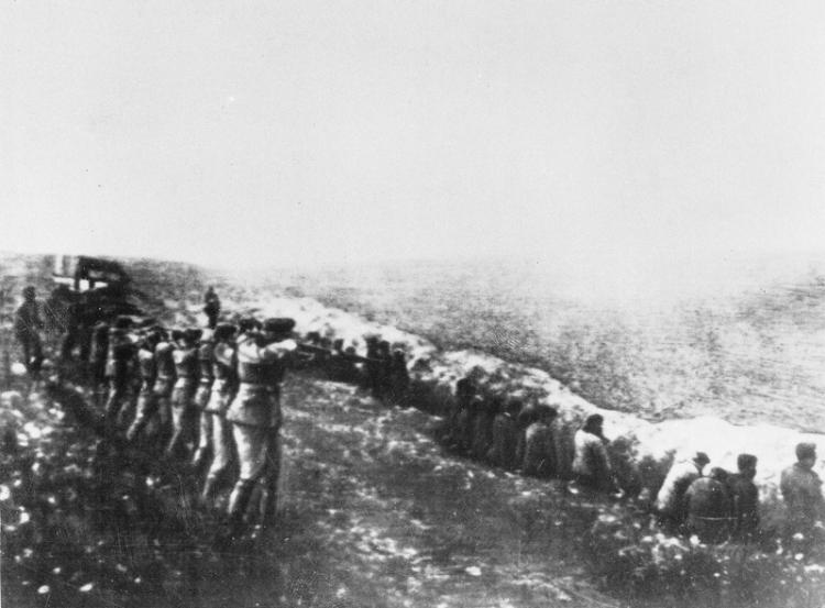 This 1942 picture, discovered on the corpse of a Nazi officer killed in Russia, depicts a Nazi fire squad murdering Soviet people at Babi Yar, Kiev.