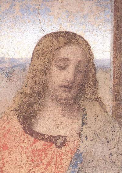 Leonardo Da Vinci's Jesus with faded colors and peeling plaster.