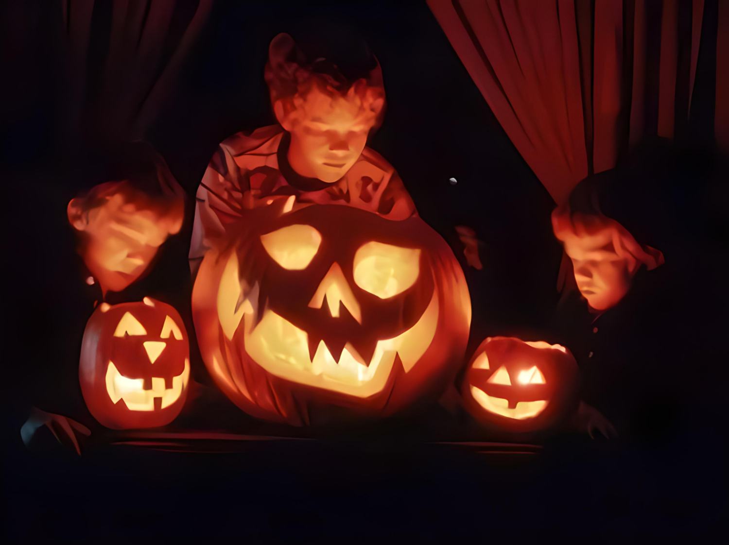 Glowing Halloween pumpkins and kids in dark