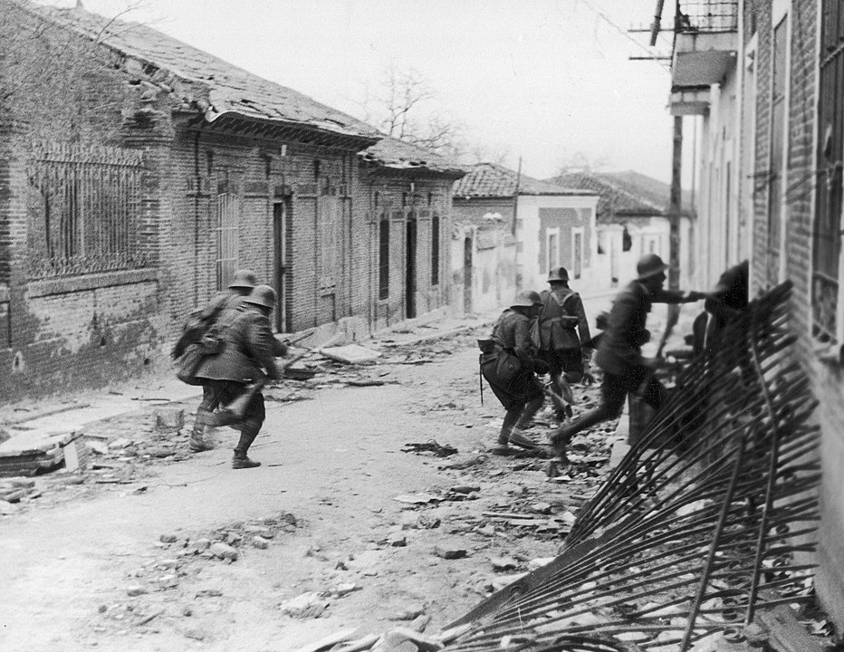 Nationalist soldiers raiding a suburb of Madrid during the Spanish Civil War
