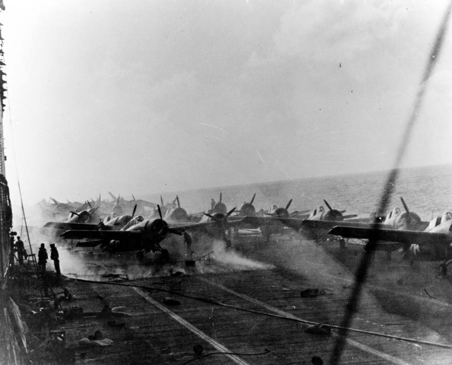 Picture taken on May 8, 1942, during the Battle of the Coral Sea, from the USS Lexington's flight deck. Fires in the hangar caused smoke to billow up towards the aircraft rear elevator. (Credit: Naval History and Heritage Command)