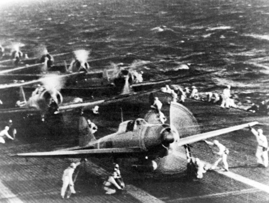 Navy planes from Japan get ready to take off from the aircraft carrier Shokaku on the morning of December 7th, 1941, as they go to attack Pearl Harbor. Front and center, you can see a Zero Fighter plane. (Credit: Naval History and Heritage Command)