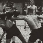 Boxing by members of the 1937 Hitler Youth program. In 1922, the Hitler Youth program was established to indoctrinate German youth with Nazi ideology and train them for a future as the master race.