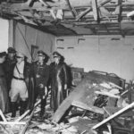 Martin Bormann, Hermann Göring, and Bruno Loerzer surveying the damaged conference room