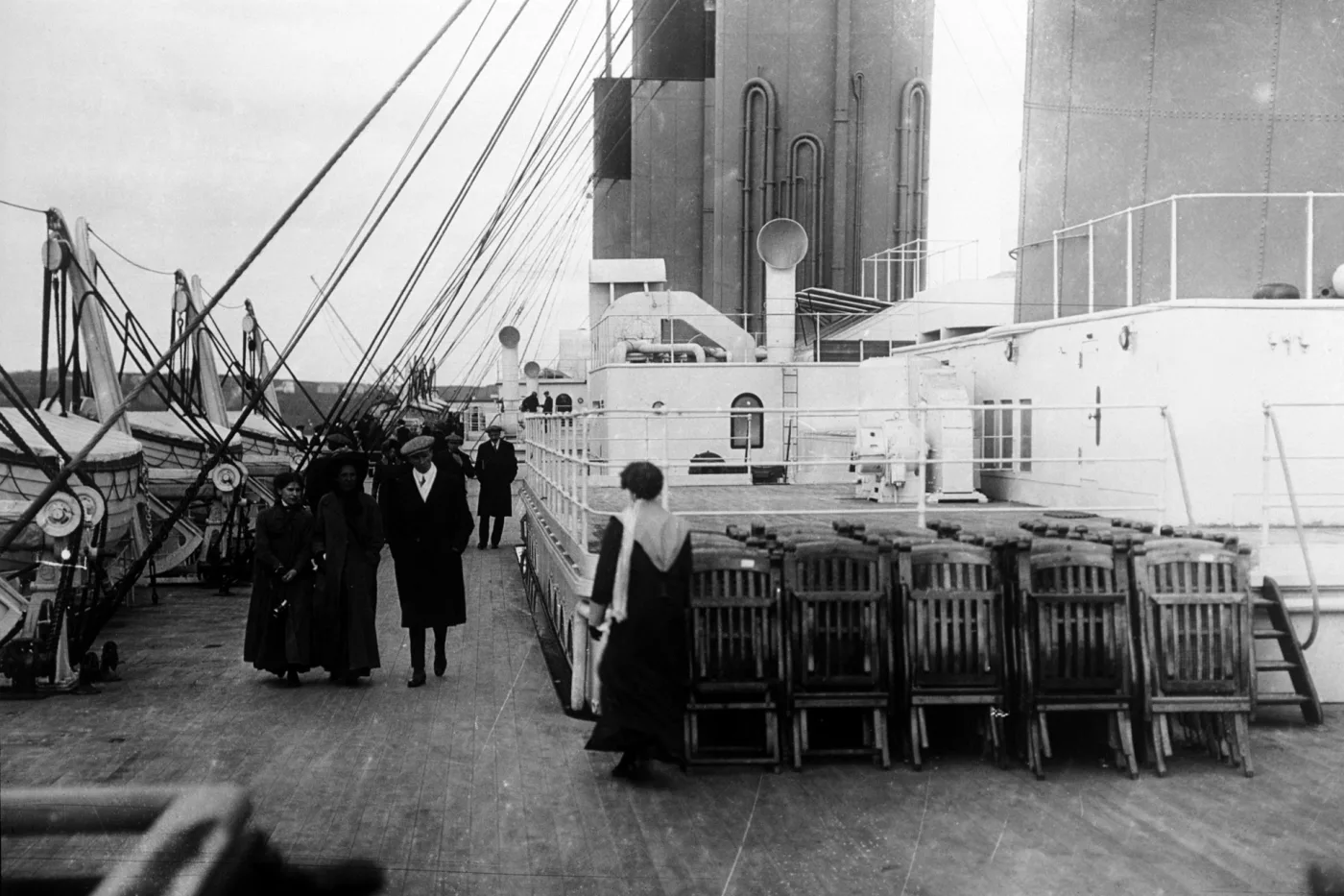 Passengers walk on the deck of the SS Titanic, 1912.