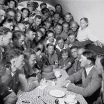 Hitler speaks to a crowd of enthralled Nazi stormtroopers and other followers at the Nazi Party’s headquarters in Munich.