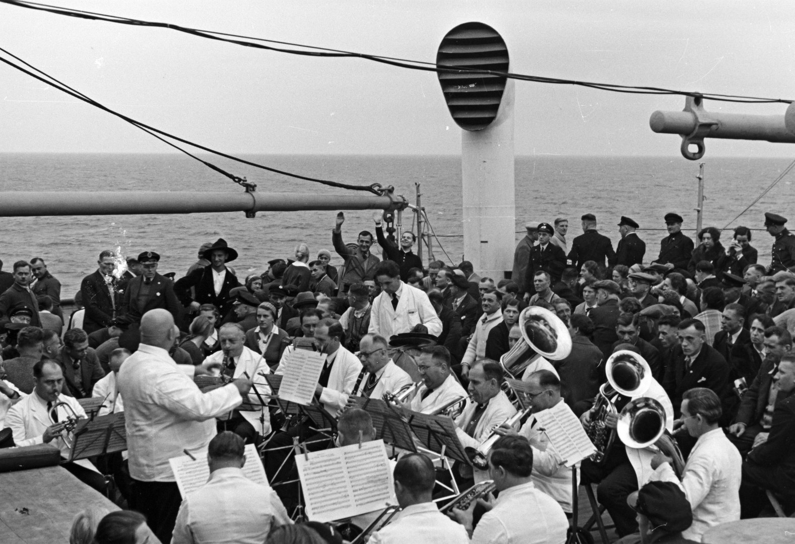 Travelers aboard a Kraft durch Freude (Strength Through Joy) cruise enjoying an orchestra performance