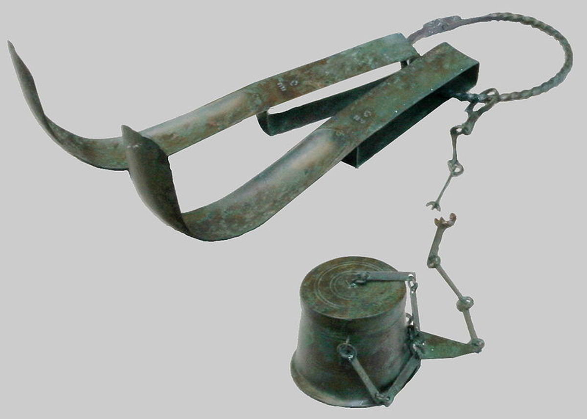 Olive flask and strigil, tools used for bathing in Ancient Rome.