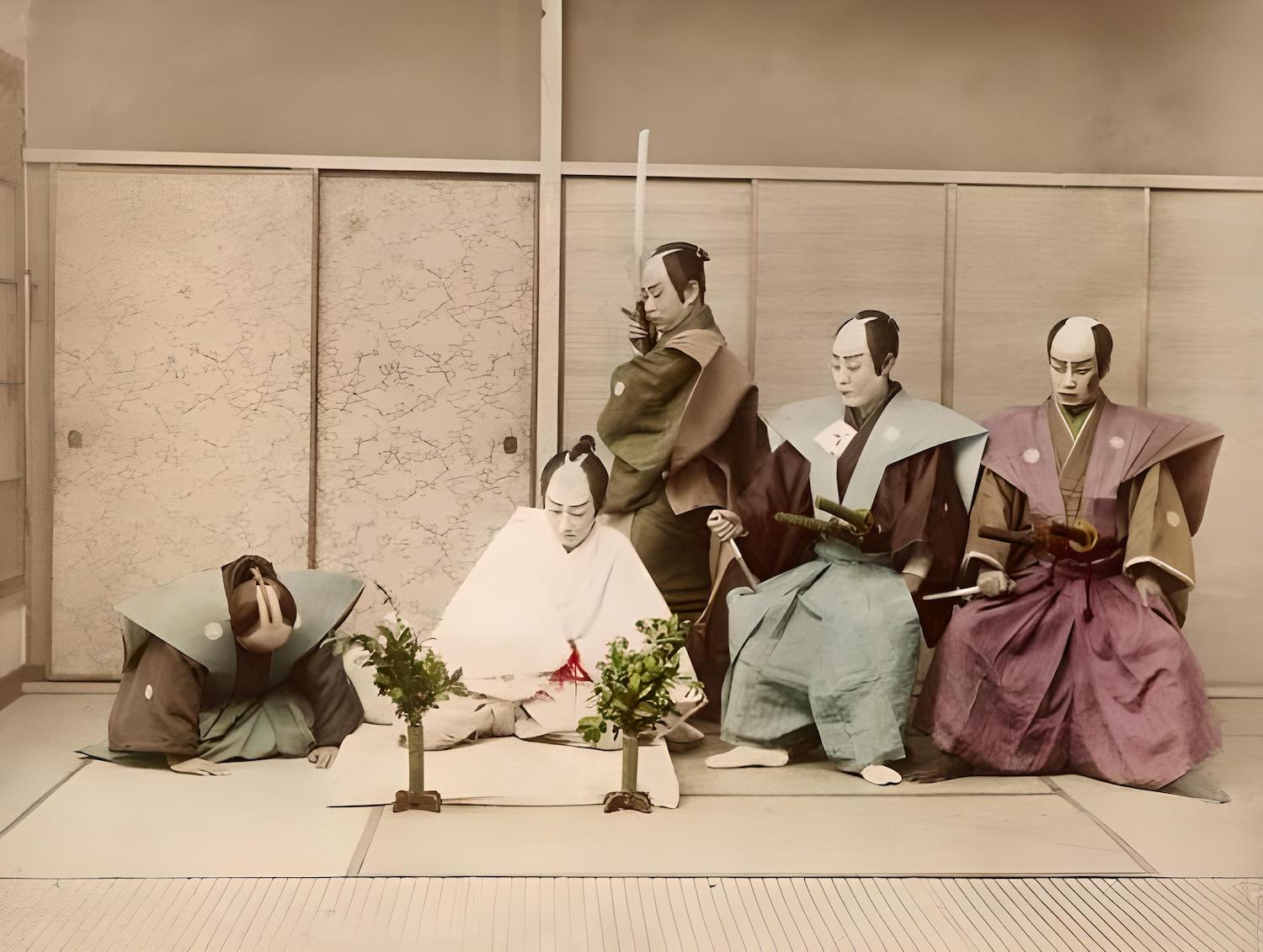 Seppuku with ritual attire and second. This is from a play in the Meiji Era. Source: Gutenberg