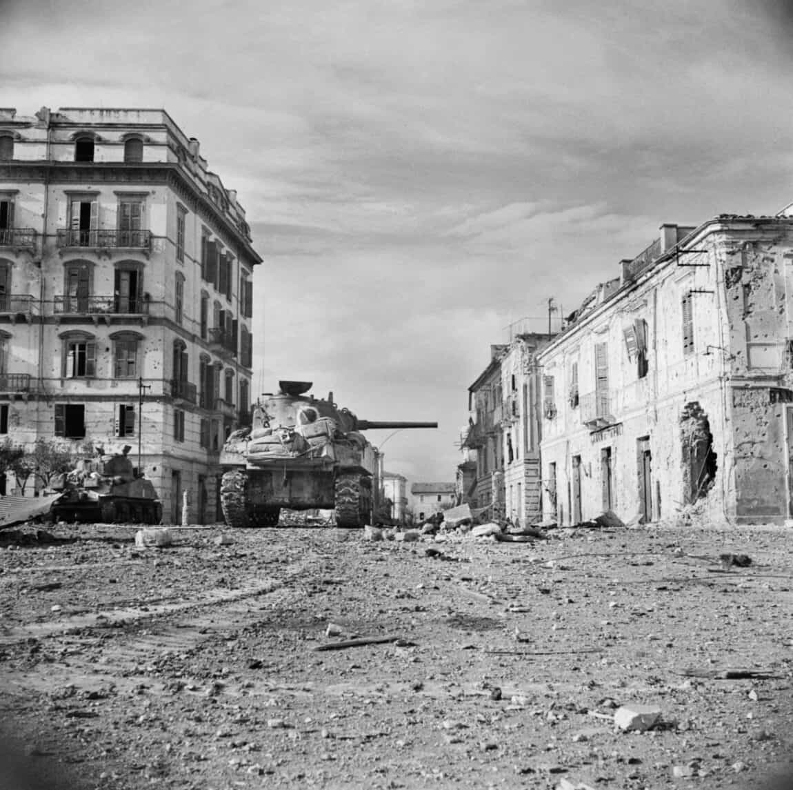 two tanks from the Canadian Three Rivers Regiment roll forward near the Gustav Line.