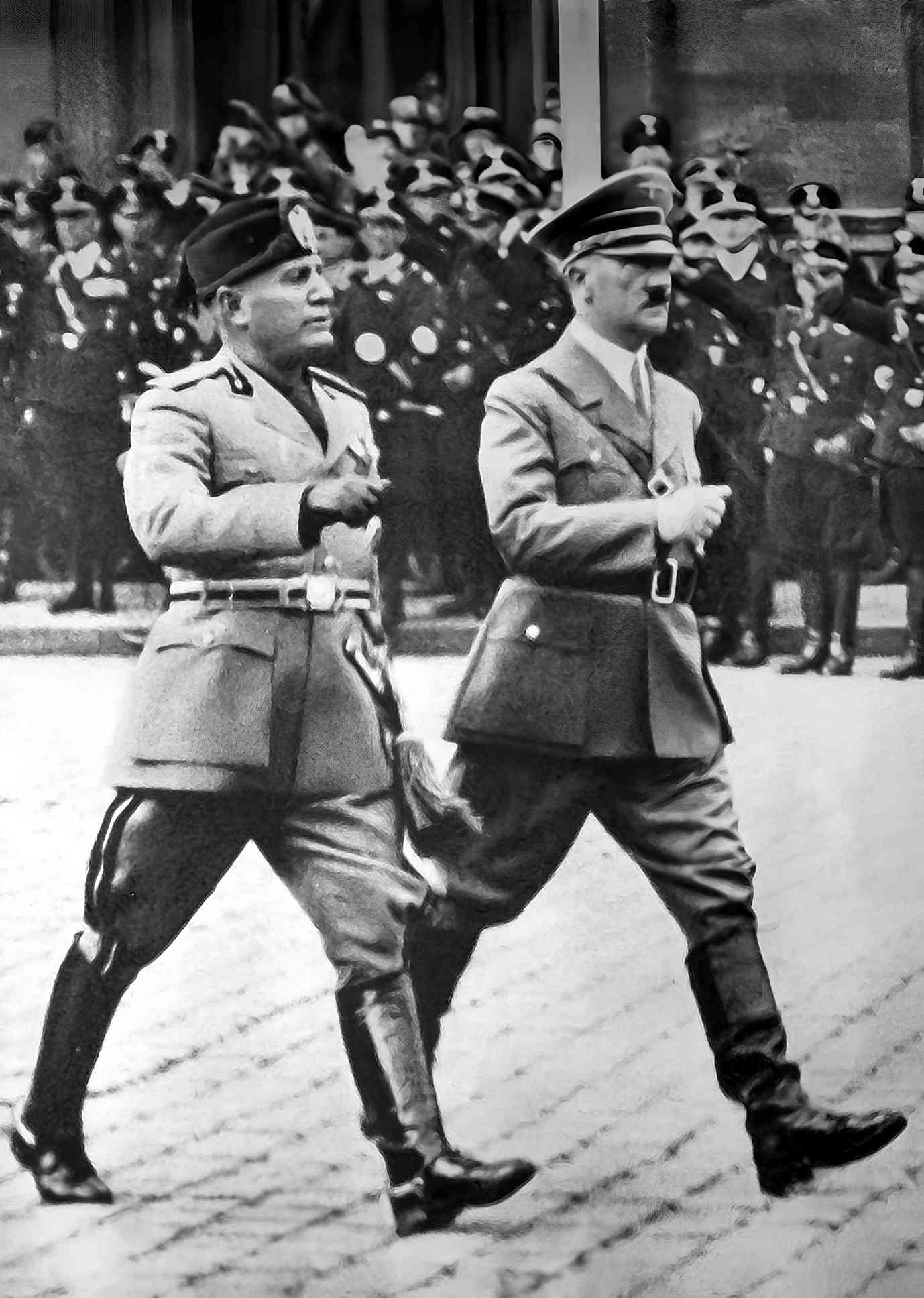 Mussolini (5ft 6.5 in) and Hitler (5 ft 9 in) walking next to each other, full body photograph. September 1937.