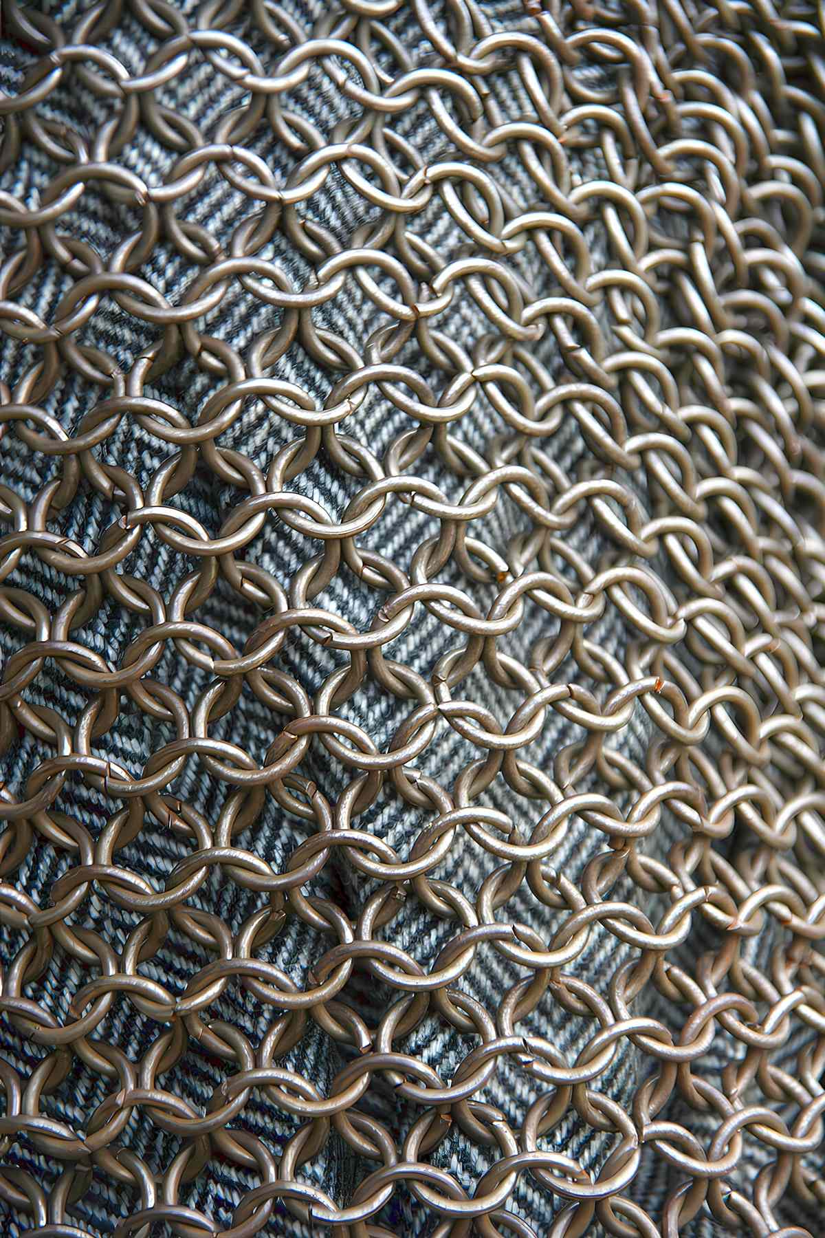 The metal rings of the lorica hamata chainmail Roman armor, a replica of the 2nd century species.