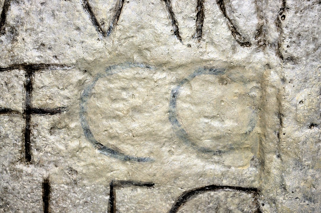 Damnatio memoriae of Commodus on an inscription in the Museum of Roman History Osterburken. The abbreviation "CO" was later restored with paint.