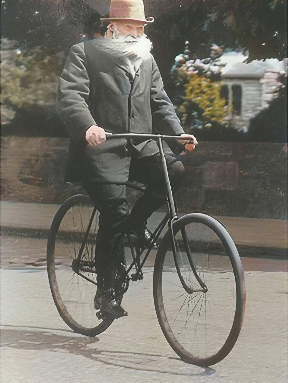 John Dunlop riding his bicycle with pneumatic tires.