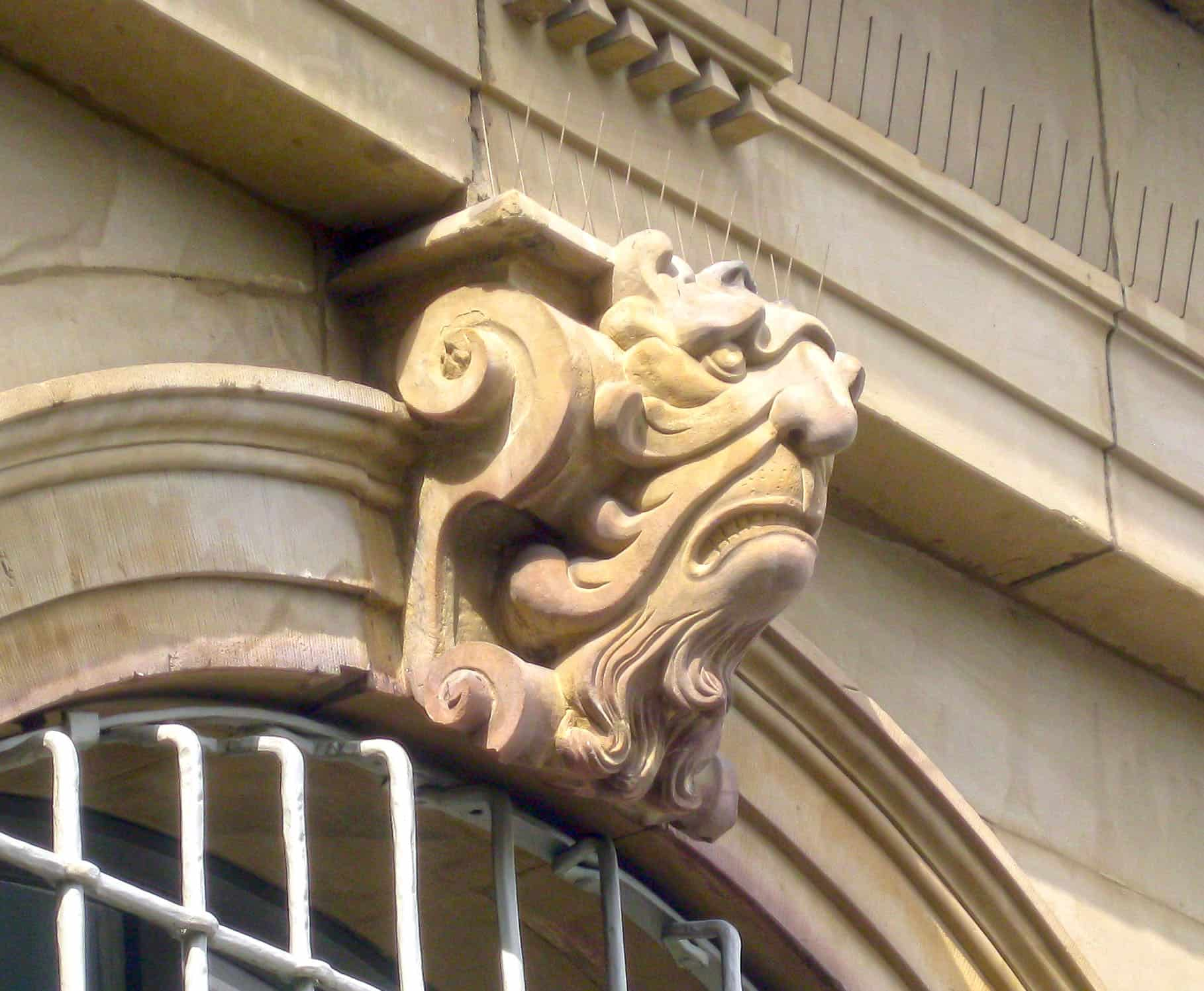 a protome mask on a building