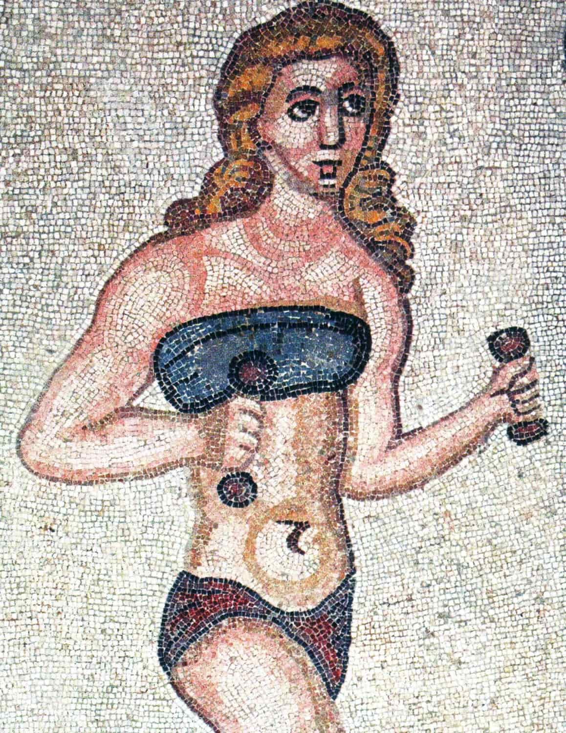 Ancient Roman sportswoman with fascia pectoralis (above) and subligaculum (bottom) on a mosaic in the Villa Romana del Casale.