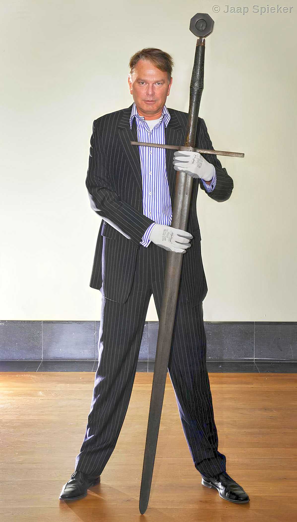 Roel Woering, business director of Fries Museum Leeuwarden with a spadone (zweihander) sword.