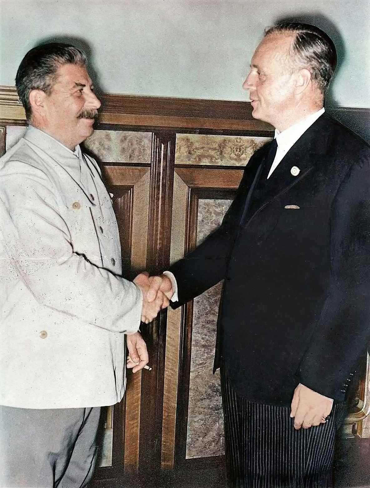 stalin and Joachim von Ribbentrop stand side by side which allow for height comparison