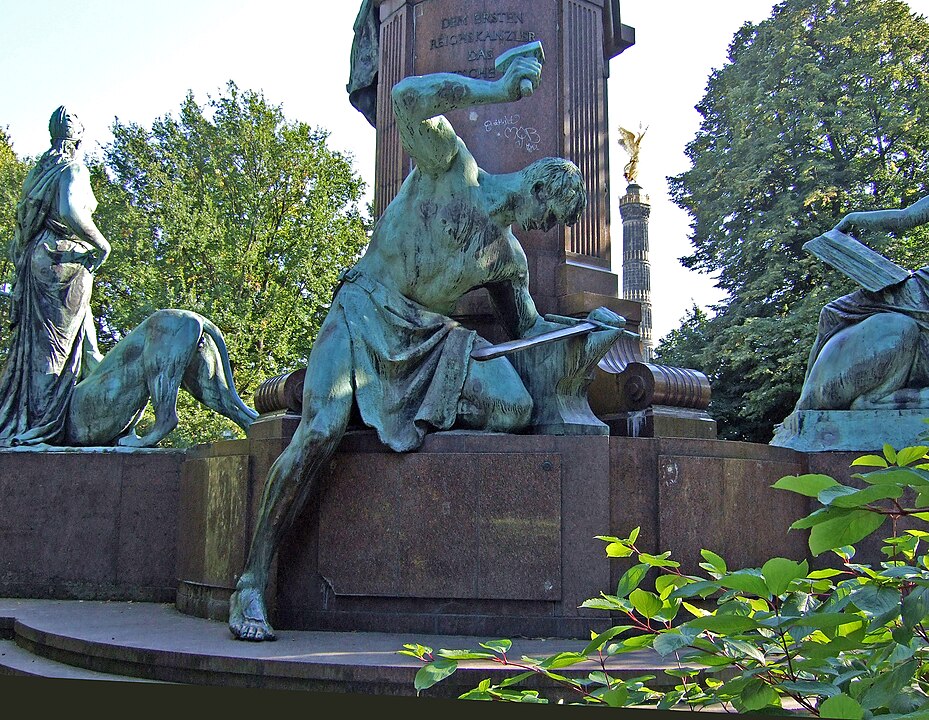 Statue of Siegfried forging the imperial sword at the Bismarck Memorial, by Reinhold Begas (1901), Berlin.