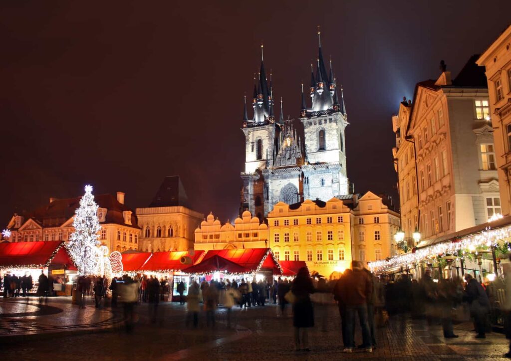 Christmas market on Old Town Square, with Church of Our Lady in front of Týn on background, Prague.