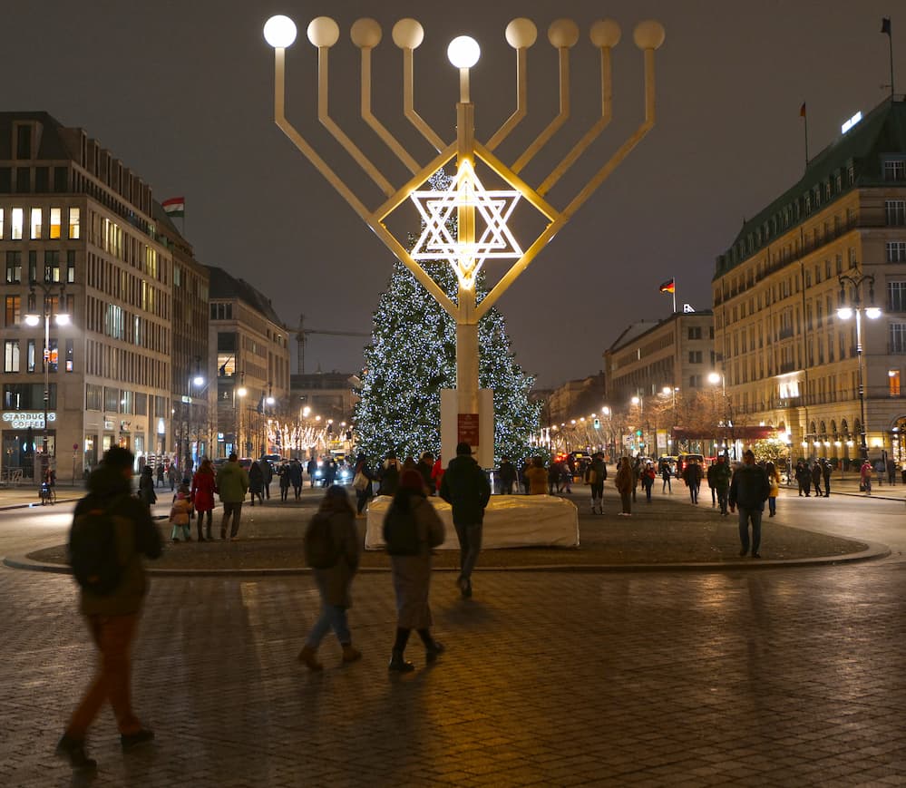 Christmas tree and Hanukkah chandelier on Pariser Platz in Berlin.