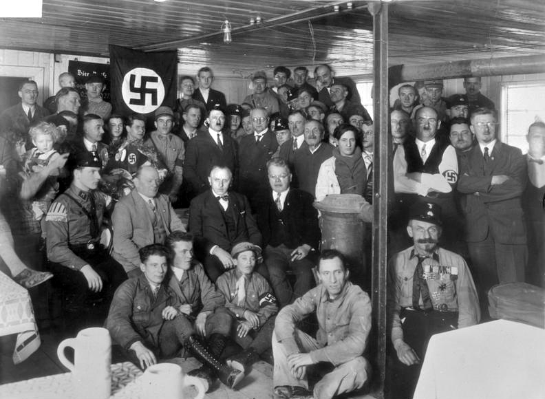 Hitler with Nazi Party members in December 1930