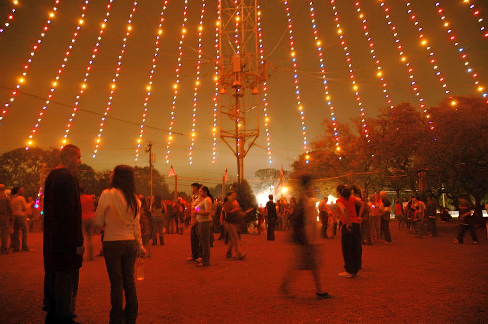 People walking under the Zilker Tree. Christmas in Austin, Texas.