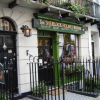 The exterior of the Sherlock Holmes Museum and doorway marked as 221B