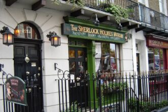 The exterior of the Sherlock Holmes Museum and doorway marked as 221B