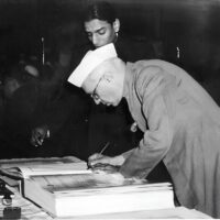 Nehru signing the Indian Constitution c.1950