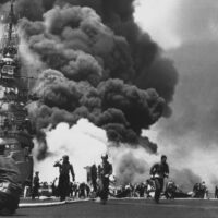 USS Bunker Hill (CV-17) afire after being hit by Kamikazes off Okinawa, 11 May 1945