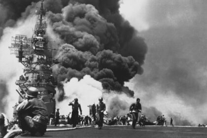 USS Bunker Hill (CV-17) afire after being hit by Kamikazes off Okinawa, 11 May 1945