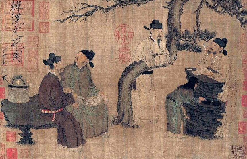 Four men dressed in robes and black square cut hats gather around a tree talking to one another. Three are sitting on rocks while the fourth is leaning over a horizontally bent branch of the tree