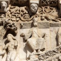 Figure of Nebuchadnezzar II on the west facade of Notre-Dame la Grande church in Poitiers.