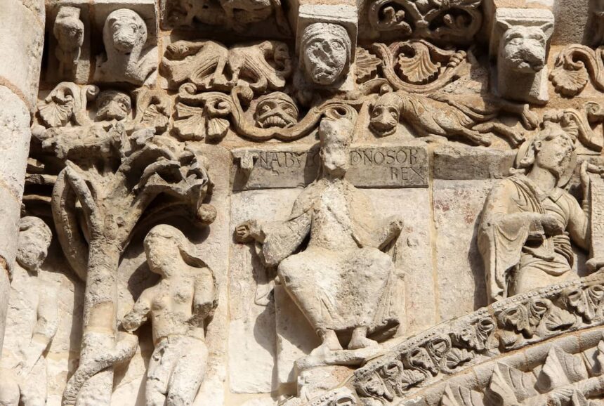 Figure of Nebuchadnezzar II on the west facade of Notre-Dame la Grande church in Poitiers.