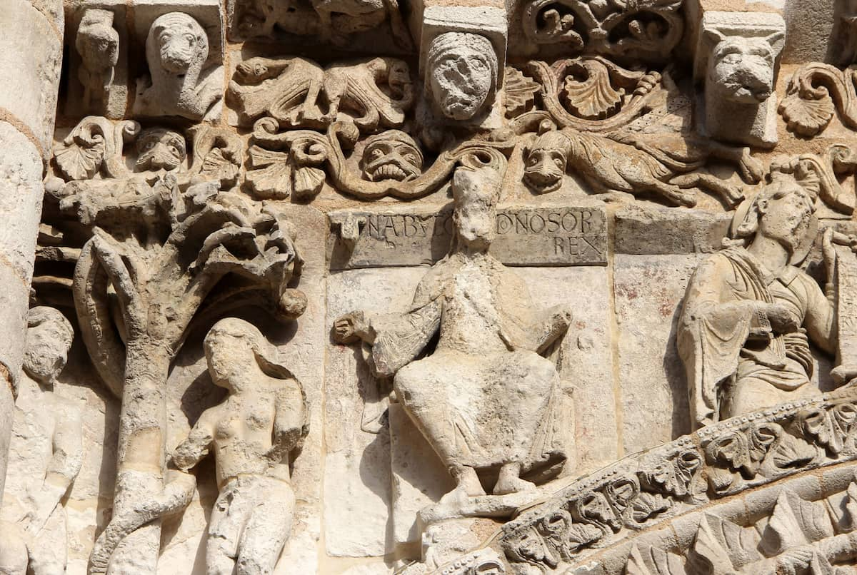 Figure of Nebuchadnezzar II on the west facade of Notre-Dame la Grande church in Poitiers.