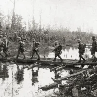 German infantrymen cross a canal on May 27, the first day of the battle