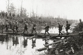 German infantrymen cross a canal on May 27, the first day of the battle